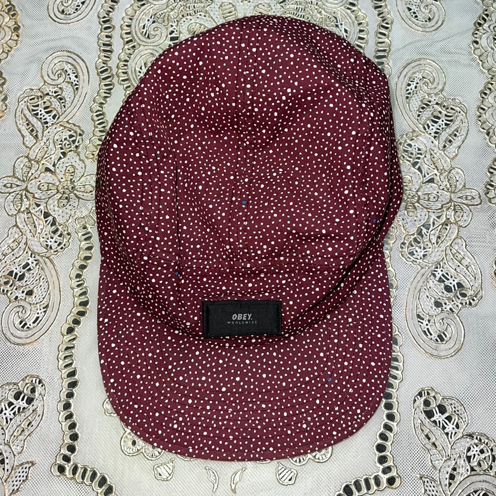 Obey red cap with white and blue dots
